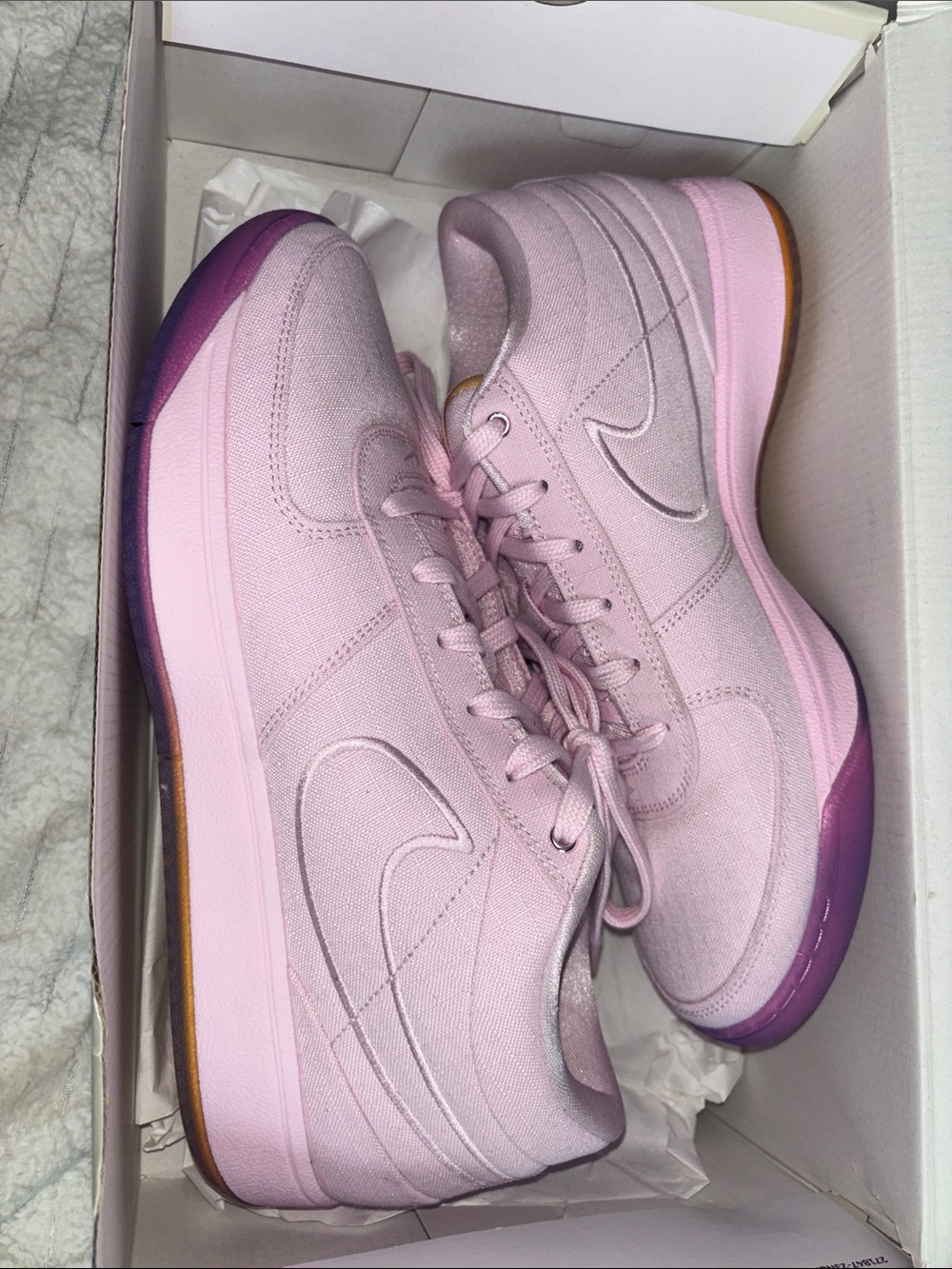 Nike Light Pink Low-Top Sneakers with Purple Outsole Accent